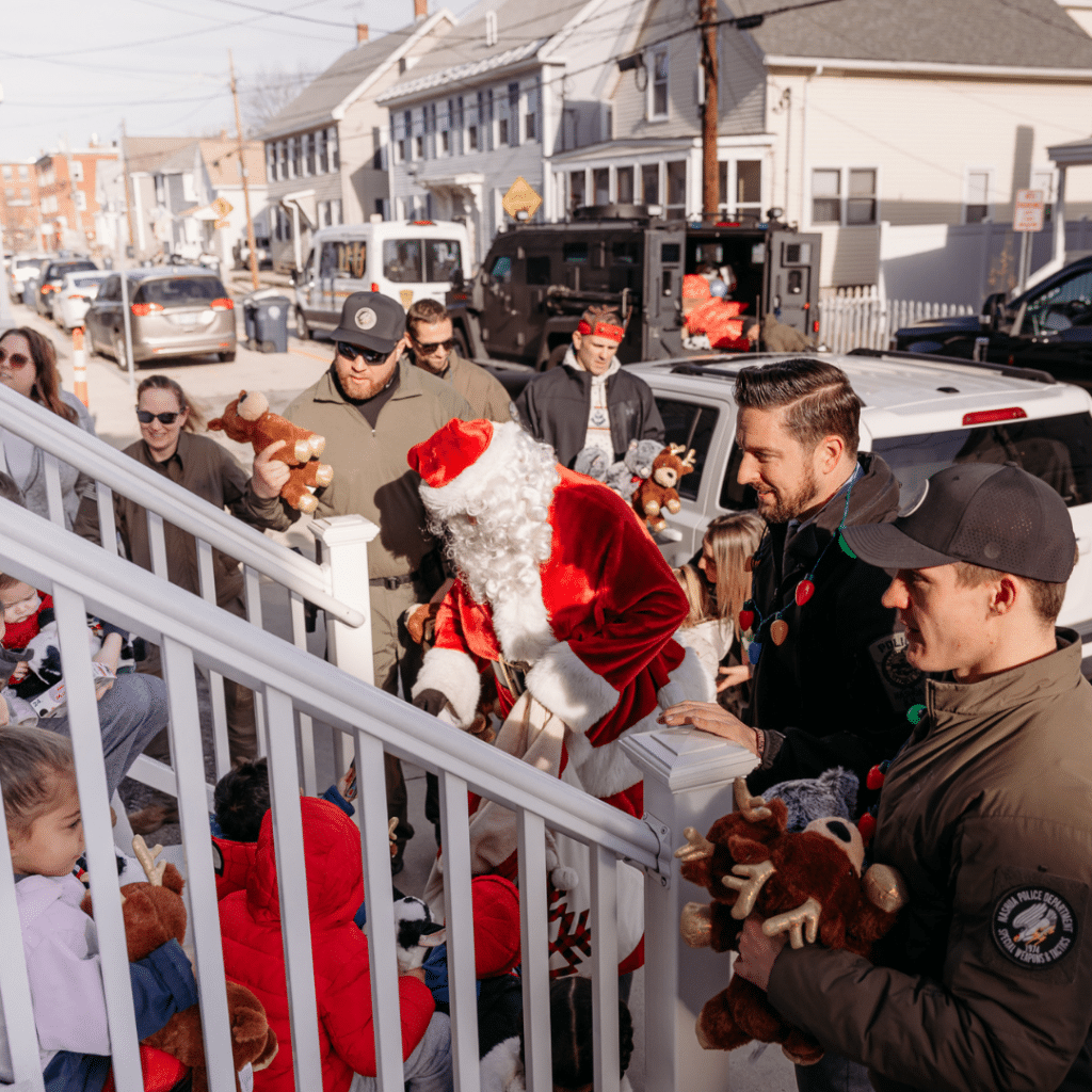 Nashua Police department celebrating the holidays by handing out gifts at Marguerite's Place